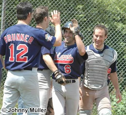 Harry Bregy is congratulated by his teammates after his first homer in almost two years.