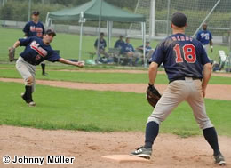 Harry Bregy about to make a wide throw off first base. It was one of three errors by the Challengers.