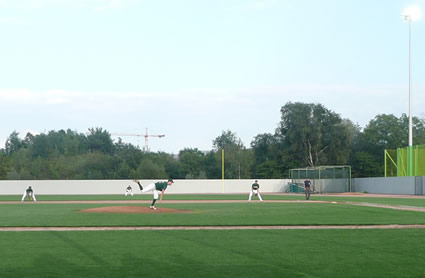 Andi Rüesch of the Barracudas delivers the first pitch in the first ever night game in Swiss Baseball history.