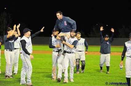 Landis is carried on the shoulders of his teammates after picking up his 100th career NLA win.